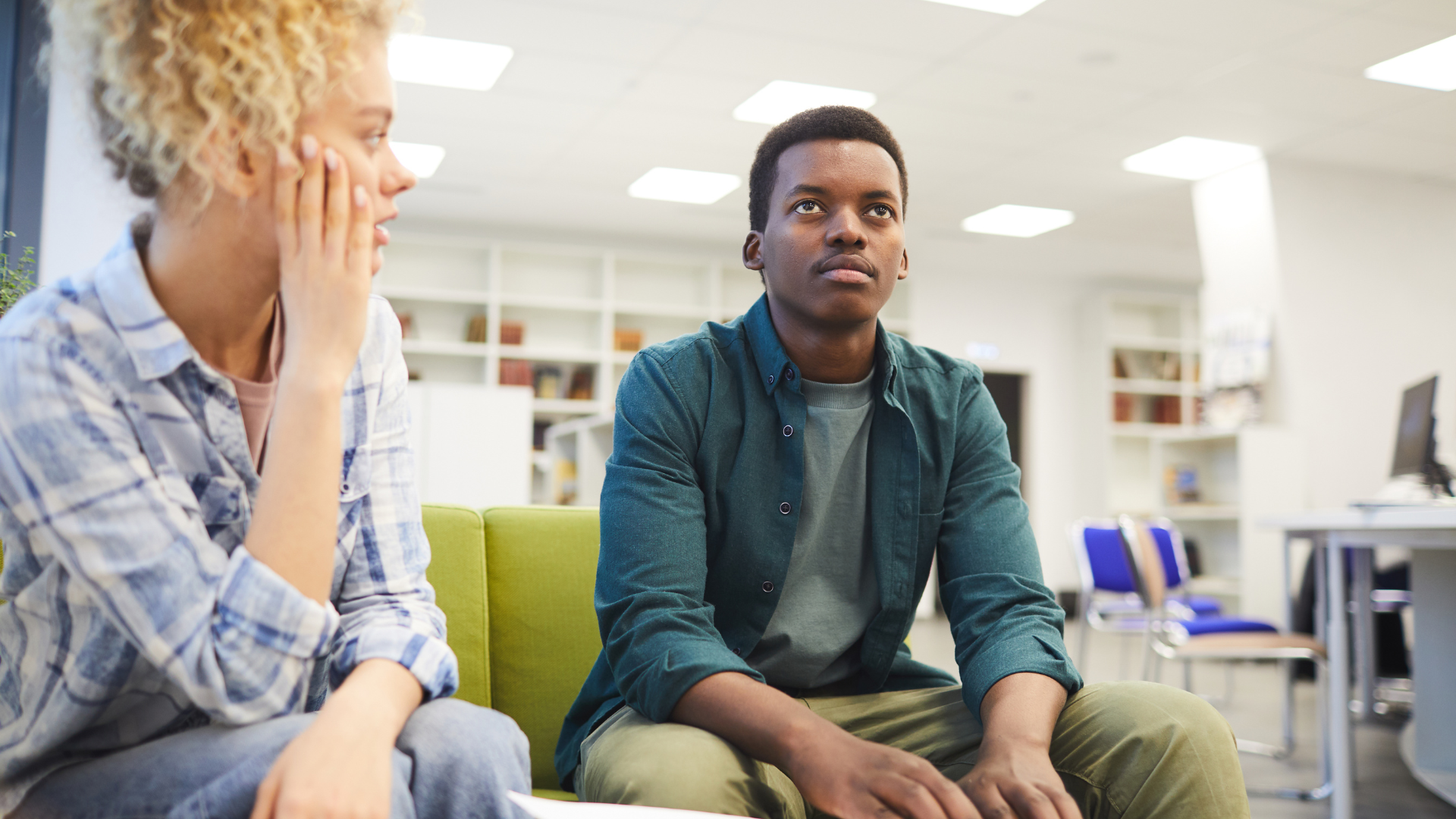 Blind student learning braille with a TVI.