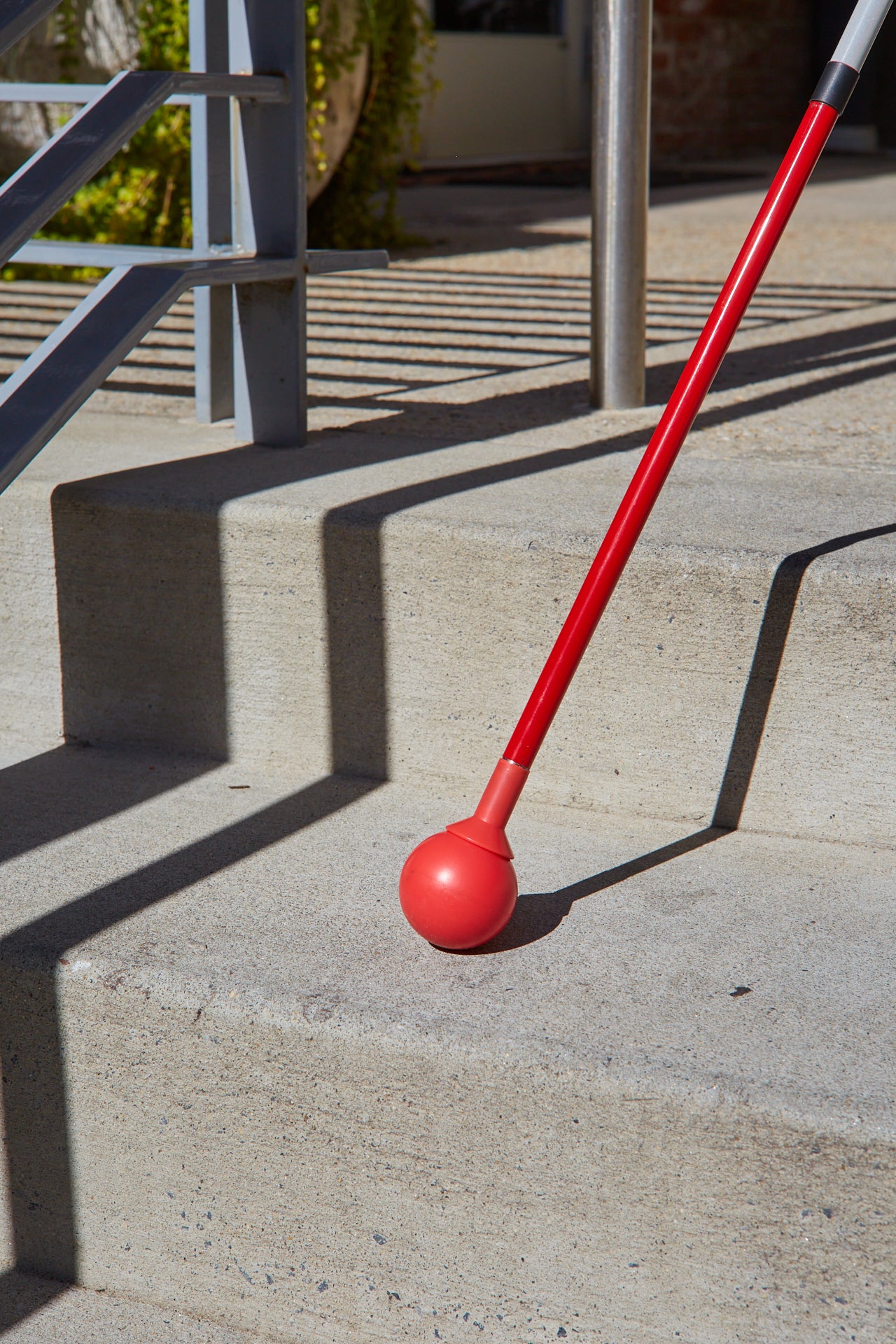 Awarewolf Gear All Terrain Cane in an urban environment.