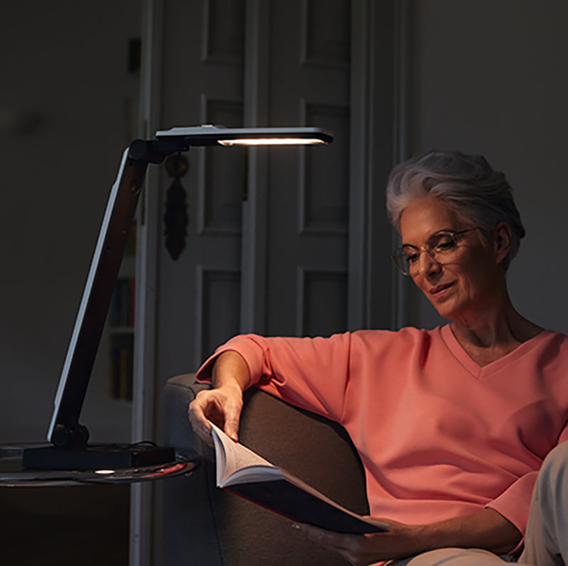 Elumentis LED Desk Lamp being used as a reading light.