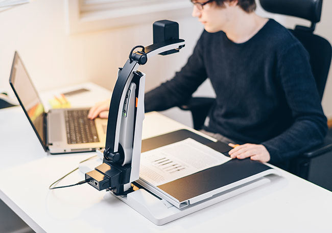 MagniLink S on deak wth laptop (not included).