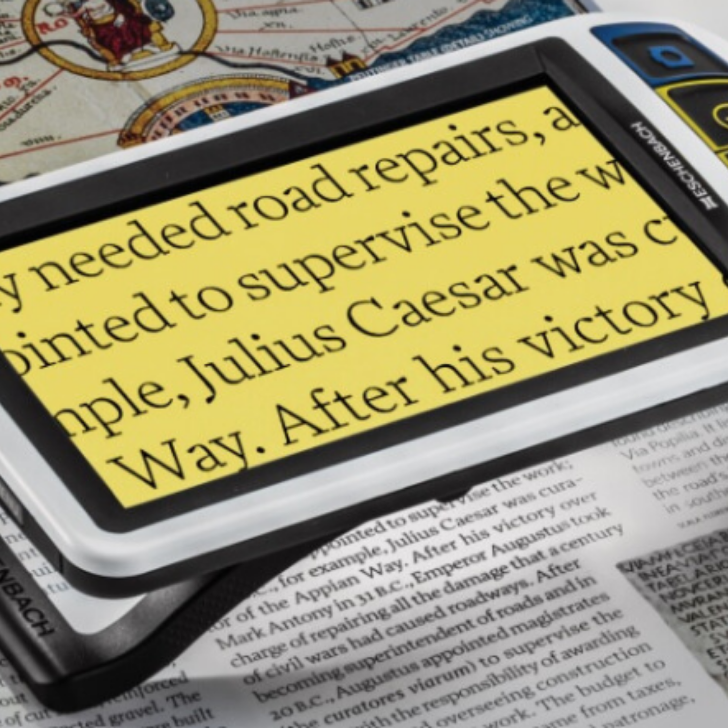 Handheld video magnifier with enlarged text on high color contrast black on yellow screen.
