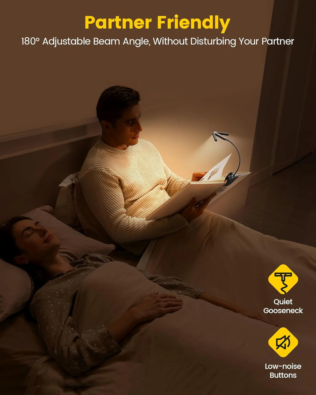 Man reading a book in bed using the Tri-Head Book Light while his partner sleeps.