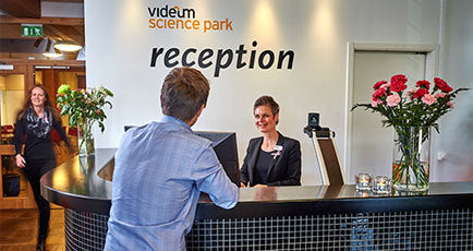 Man using MagniLink Pro at professional reception.