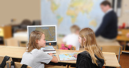 Woman sitting in front of a desk with a Magnilink Zip on it.