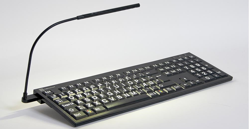Left angle image of the LogicKeyboard Nero LargePrint Slimline White on Black Keyboard for PC with included book light.